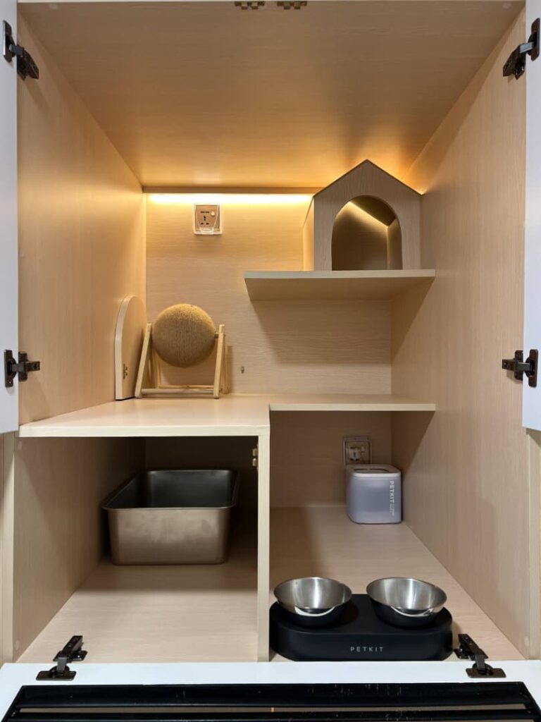 Actual CuteCats Cullinan Room, showing the raised hideaway, shelves, litter tray, feeding bowls and water fountain.